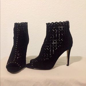 Black high heeled open toed booties